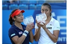 EASTBOURNE, ENGLAND - JUNE 21:  Hao-Ching and Yung-Jan Chan of Chinese Taipei poses with the trophy after beating Martina Hingis of Switzerland and Flavia Pennetta of Italy during their Women's Doubles Finals match on day eight of the Aegon International at Devonshire Park on June 21, 2014 in Eastbourne, England. (Photo by Jan Kruger/Getty Images)